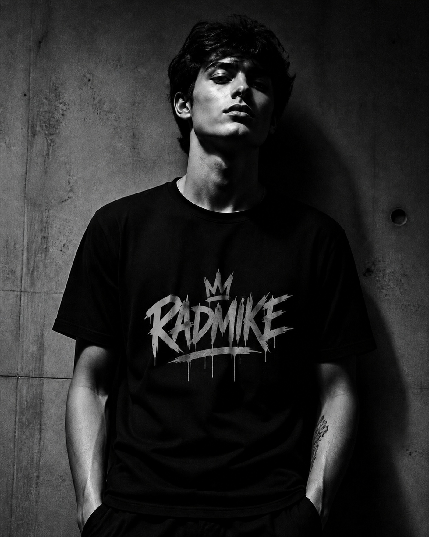 Model wearing a premium black Dark Threads t-shirt against concrete